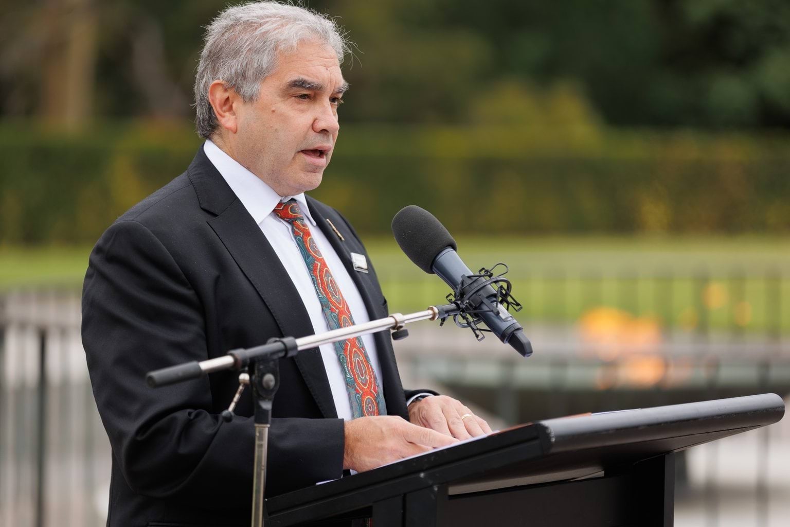 Dr Andrew Peters speaking at the Shrine of Remembrance lectern. 
